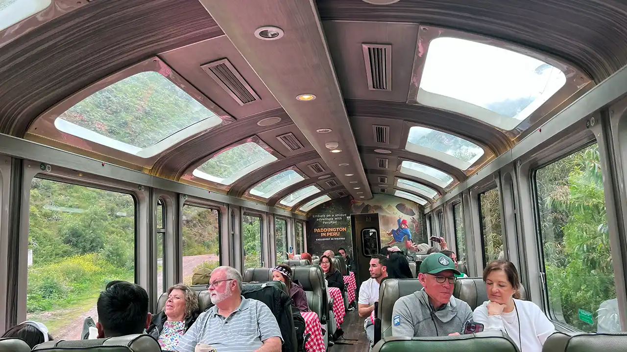 Getting to Machu Picchu from Cusco: Luxury train interior with panoramic windows.