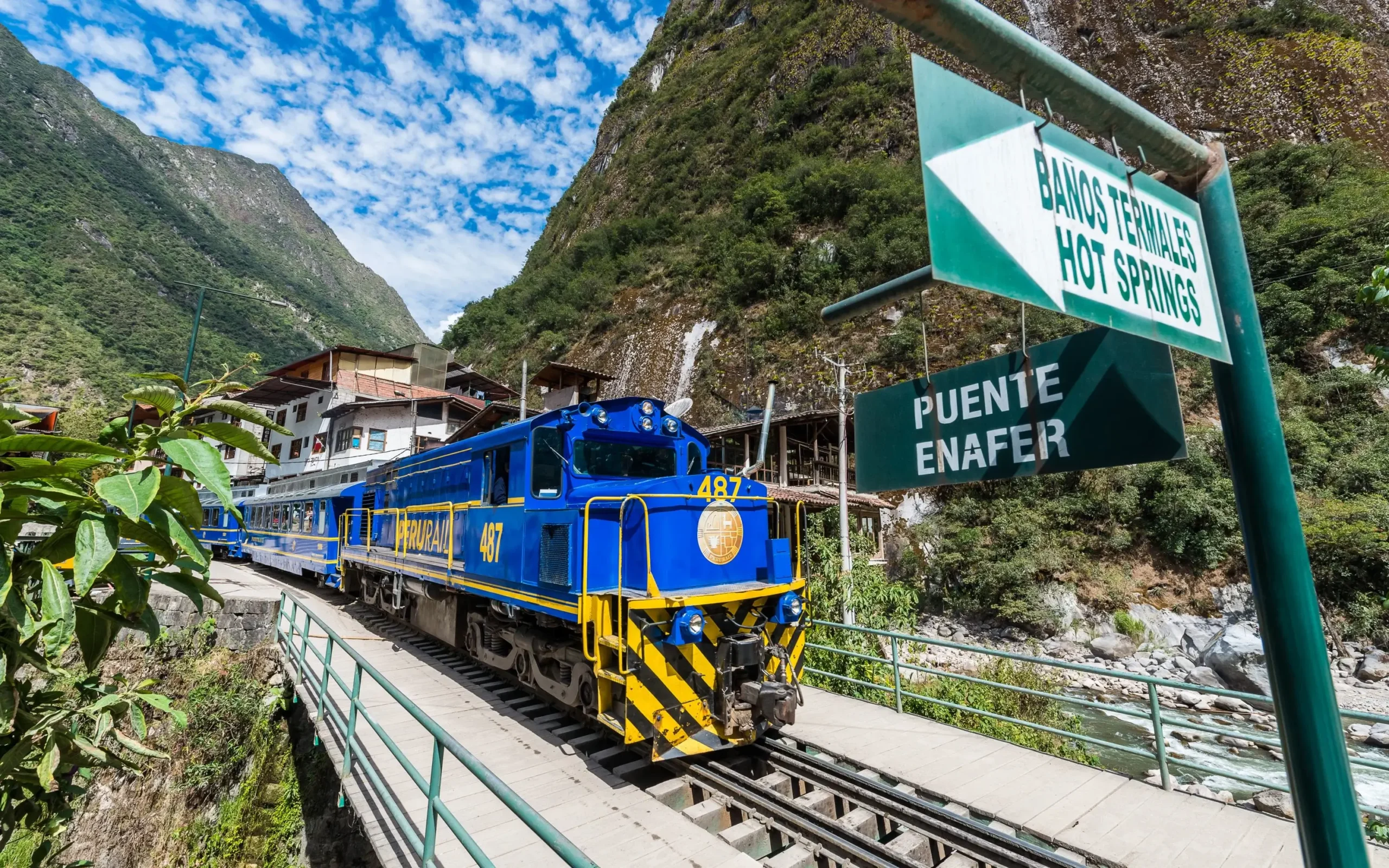 Official Machu Picchu transport guide: Panoramic Vistadome train crossing the Sacred Valley.