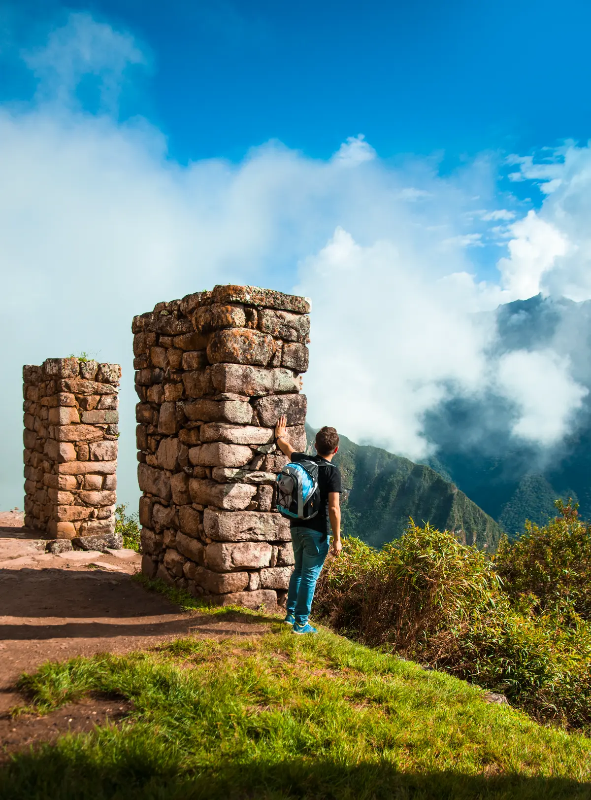 Inca Trail to Machu Picchu - hiker at stone ruins, Peru